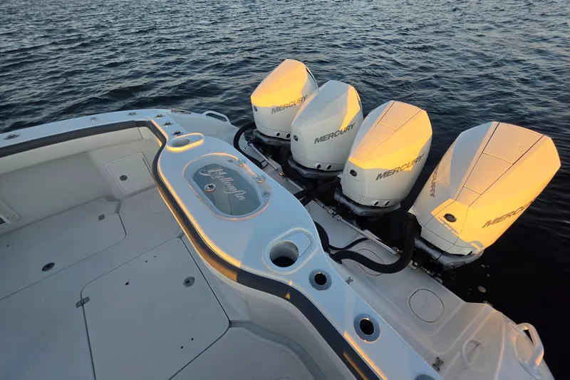 Slide: The Image of 2019 Yellowfin 42 Offshore boat with four Mercury outboard engines on the water. - 23