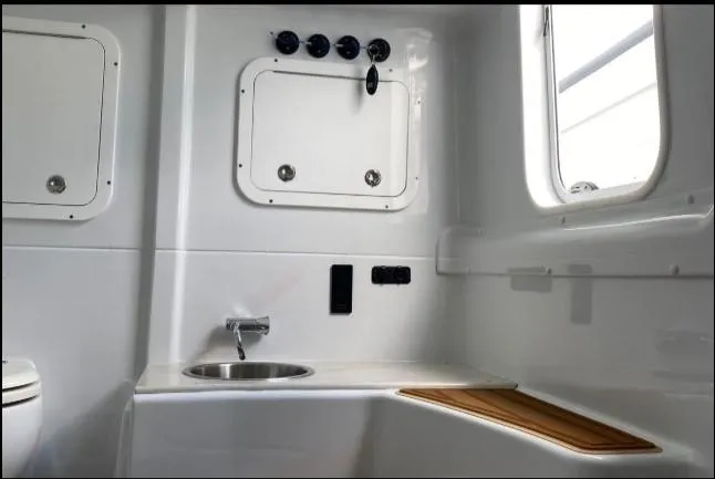 Slide: The Image of 2019 Yellowfin Center Console boat interior with sink and storage compartments. - 27