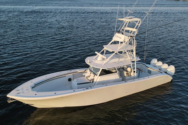 Slide: The Image of 2019 Yellowfin 42 Offshore boat on calm water, featuring multiple outboard engines. - 6