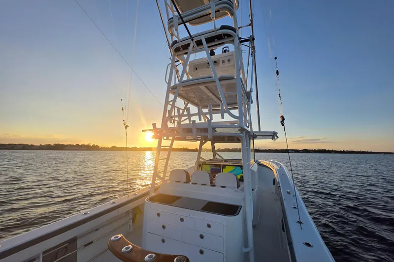 Slide: The Image of 2019 Yellowfin 42 Offshore boat at sunset on calm waters. - 8