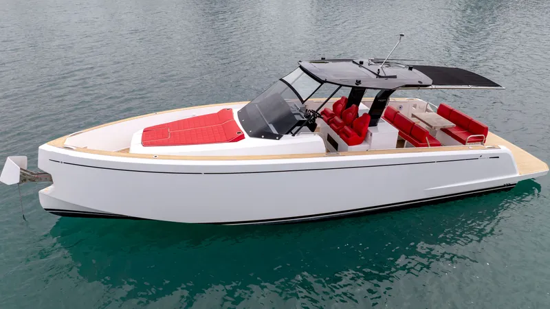 Slide: The Image of Pardo Yachts 38, 2023, luxury white yacht with red seating on calm water. - 11