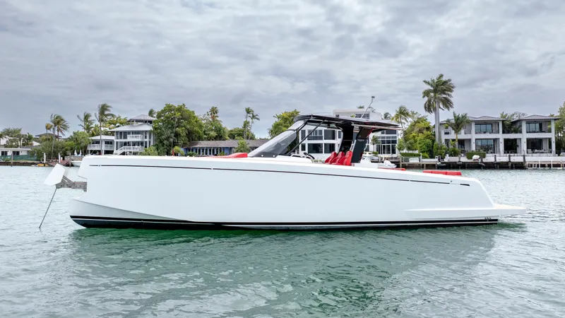 Slide: The Image of 2023 Pardo Yachts 38 on calm water near modern homes. - 15