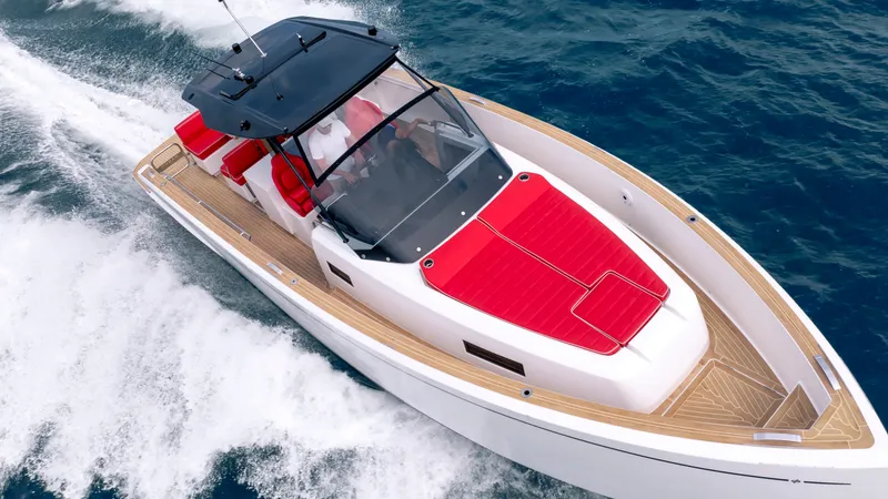 Slide: The Image of 2023 Pardo Yachts 38 cruising on water, red upholstery. - 20