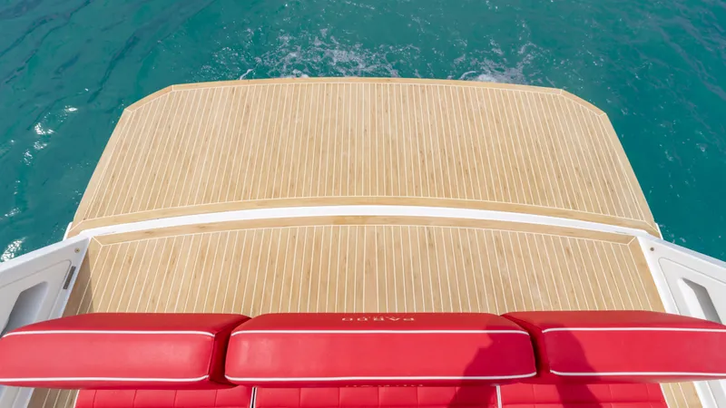 Slide: The Image of Pardo Yachts 38, 2023, featuring sleek wooden deck and red seating. - 28