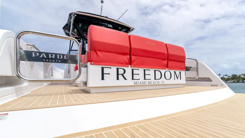 Slide: The Image of Pardo Yachts 38, 2023, with red seating and "Freedom" lettering. - 30