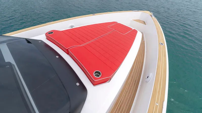 Slide: The Image of Pardo Yachts 38, 2023, featuring red sun deck on open sea. - 33