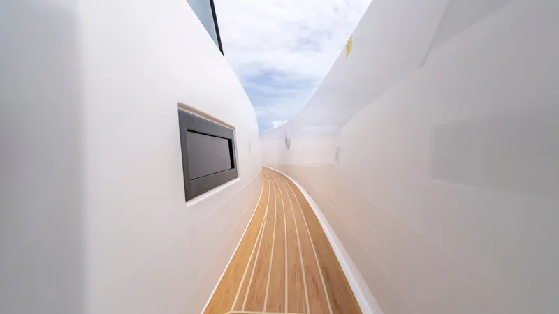 Slide: The Image of Pardo Yachts 38, 2023 model walkway with wooden deck. - 34