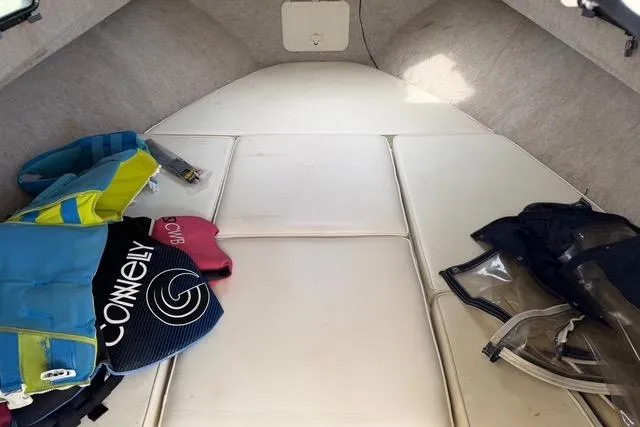 Slide: The Image of Interior of a 2005 Parker 2501 Center Console boat with life jackets and gear. - 5