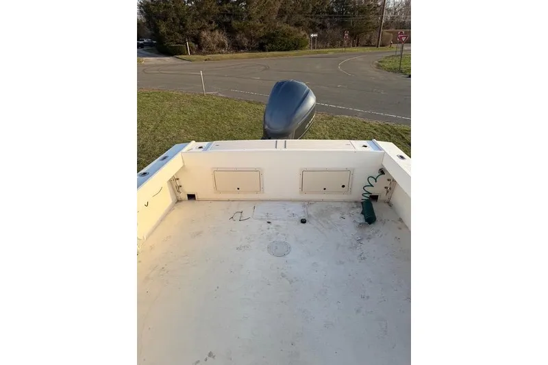 Slide: The Image of 2005 Parker 2501 Center Console boat interior with outboard motor. - 8