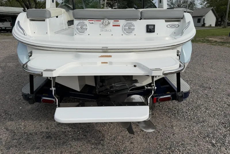 Slide: The Image of Rear view of a 2016 Cobalt 220 boat with swim platform and propeller. - 14