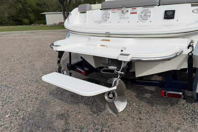 Slide: The Image of Rear view of 2016 Cobalt 220 boat with propeller and swim platform. - 15
