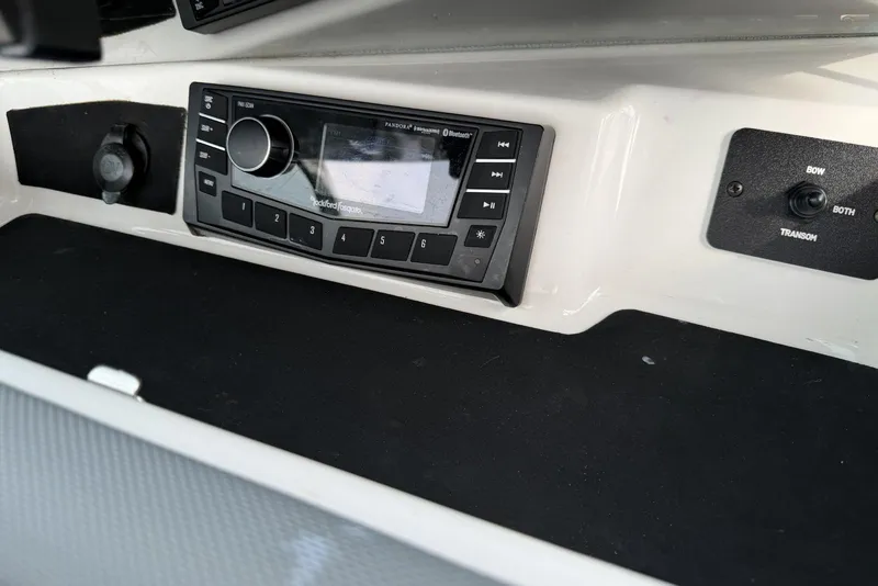Slide: The Image of Dashboard of a 2016 Cobalt 220 boat featuring a Rockford Fosgate audio system. - 23