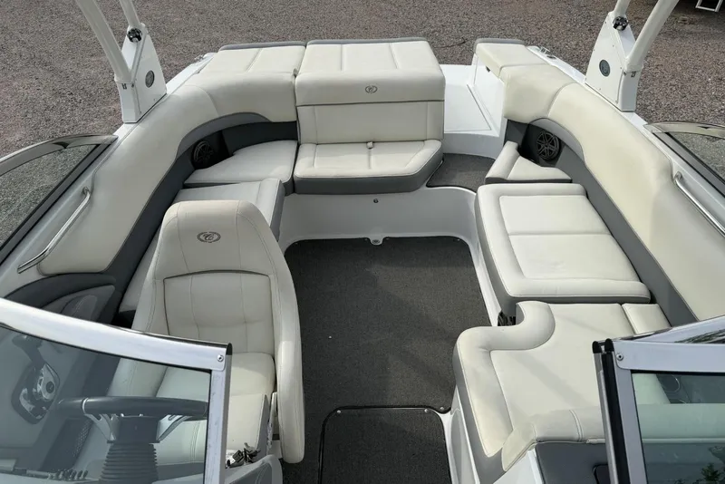 Slide: The Image of 2016 Cobalt 220 boat interior with white leather seating and spacious layout. - 29