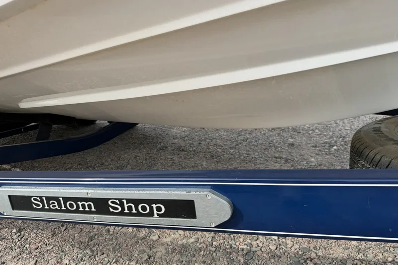 Slide: The Image of Trailer for 2016 Cobalt 220 boat with "Slalom Shop" branding. - 9