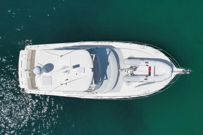 Slide: The Image of Aerial view of 2003 Riviera 40 Flybridge yacht on clear blue water. - 11