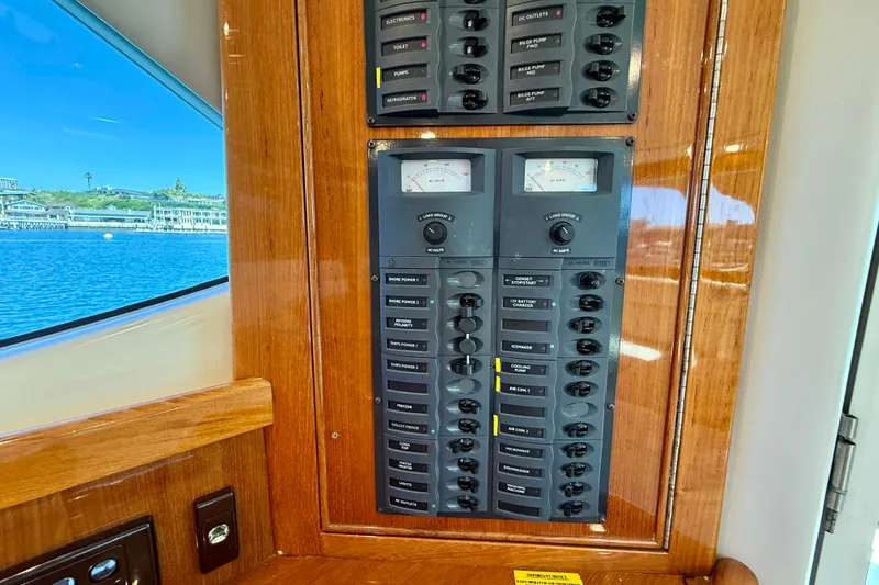 Slide: The Image of Electrical panel on a 2003 Riviera 40 Flybridge yacht, with scenic water view. - 22