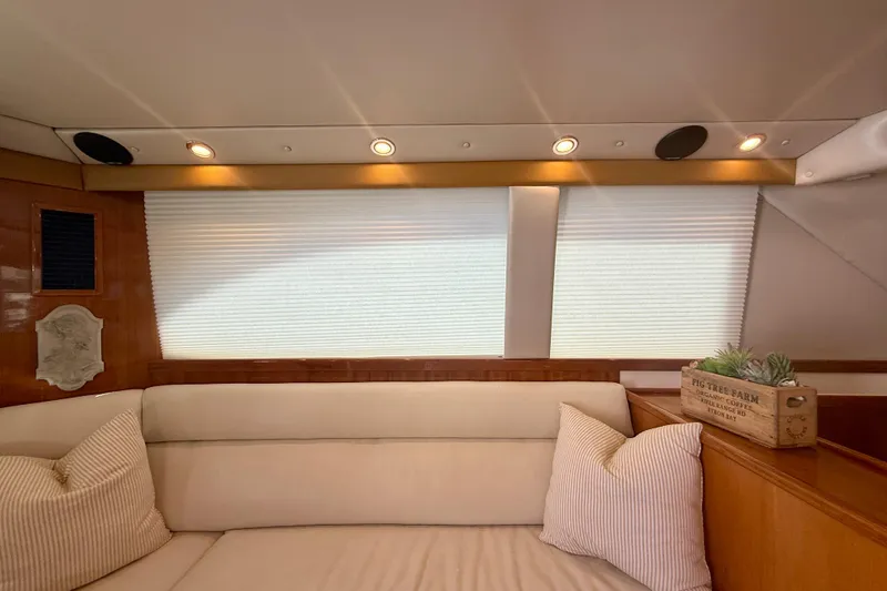 Slide: The Image of Luxurious interior of 2003 Riviera 40 Flybridge yacht with comfortable seating and decor. - 24