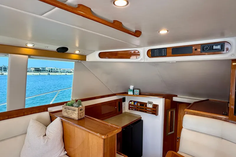 Slide: The Image of Interior of 2003 Riviera 40 Flybridge yacht with elegant wood finishes and modern amenities. - 27