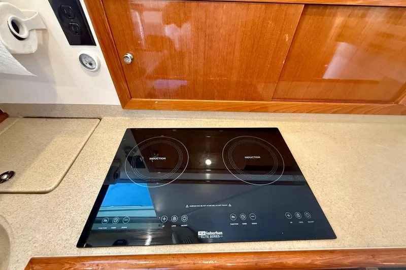 Slide: The Image of Induction cooktop in 2003 Riviera 40 Flybridge yacht kitchen. - 29