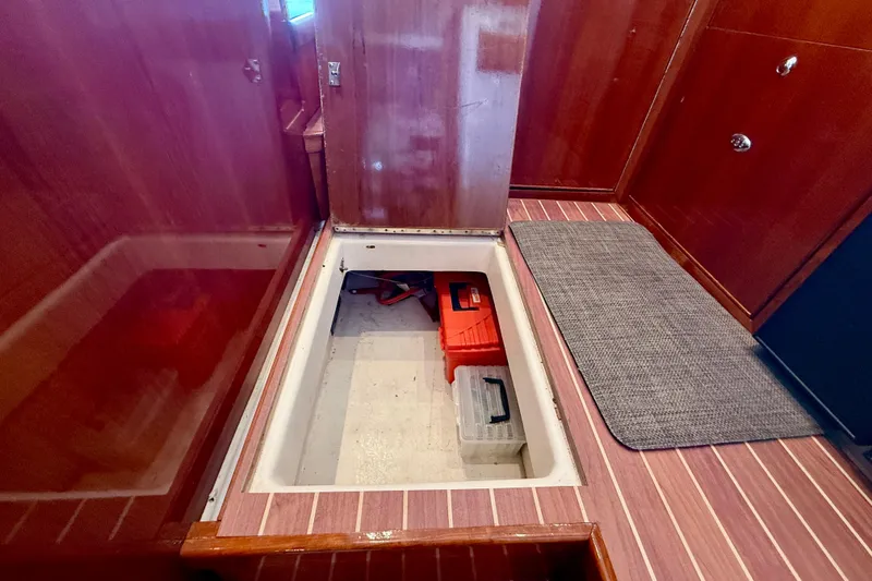 Slide: The Image of Storage compartment on 2003 Riviera 40 Flybridge boat with toolboxes inside. - 35