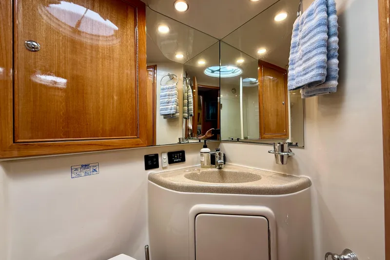 Slide: The Image of Luxurious bathroom in 2003 Riviera 40 Flybridge yacht with wood cabinetry and modern fixtures. - 47