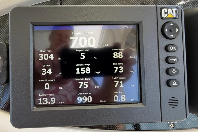 Slide: The Image of CAT engine monitor displaying various metrics for a 2003 Riviera 40 Flybridge yacht. - 59