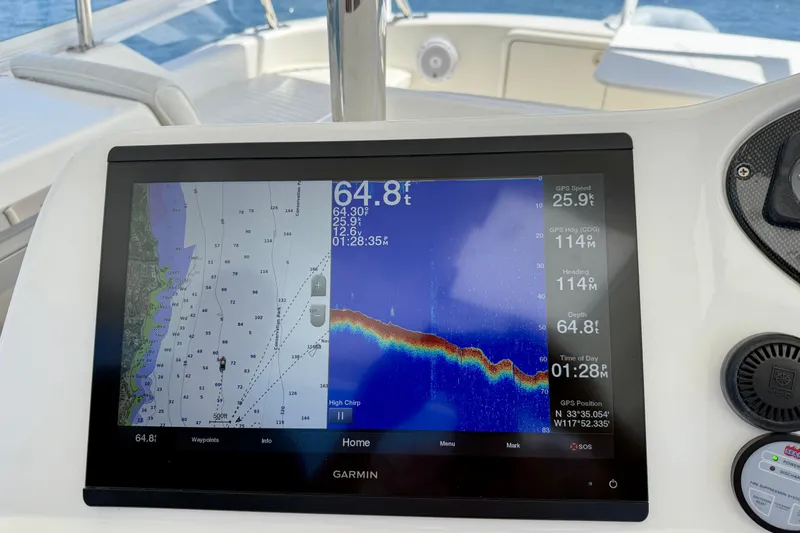 Slide: The Image of Garmin navigation display on 2003 Riviera 40 Flybridge, showing map and sonar data. - 61