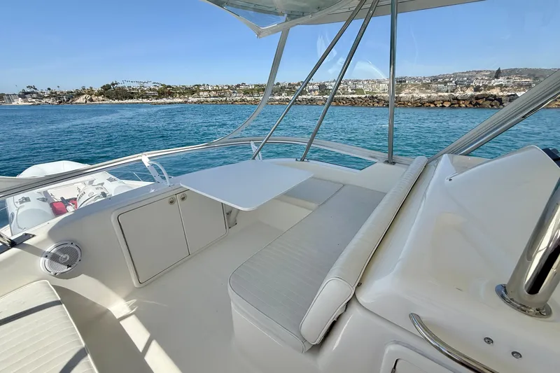 Slide: The Image of 2003 Riviera 40 Flybridge yacht interior with seating and ocean view. - 65