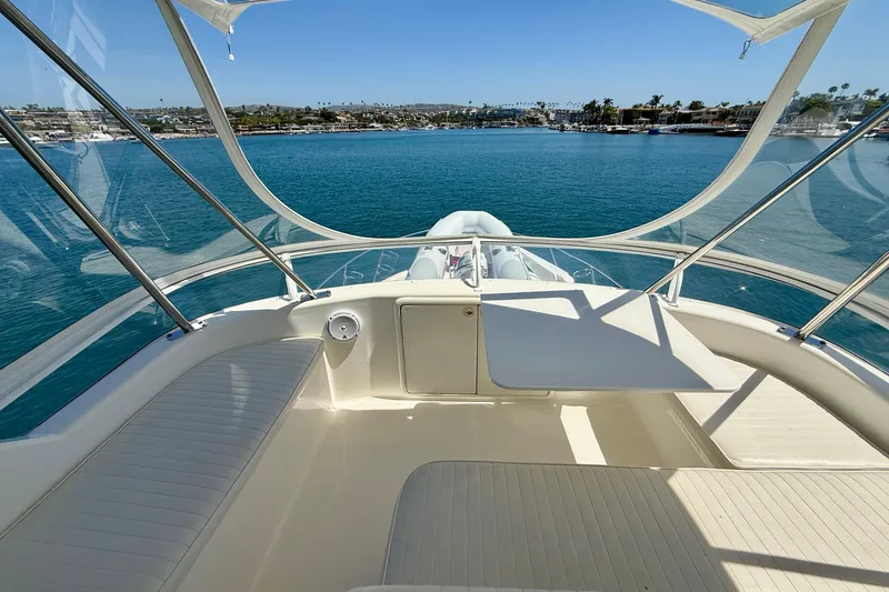Slide: The Image of 2003 Riviera 40 Flybridge yacht interior with ocean view and clear skies. - 68