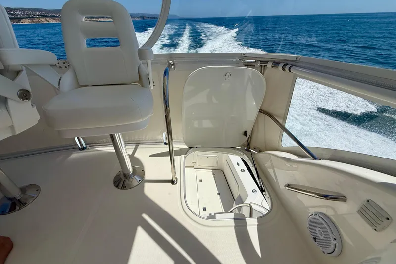 Slide: The Image of Flybridge view of 2003 Riviera 40 yacht cruising on open sea. - 73