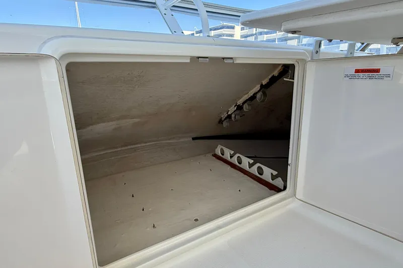 Slide: The Image of Storage compartment on a 2003 Riviera 40 Flybridge boat, open and empty. - 75