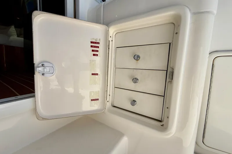 Slide: The Image of Storage compartment with drawers on a 2003 Riviera 40 Flybridge boat. - 84