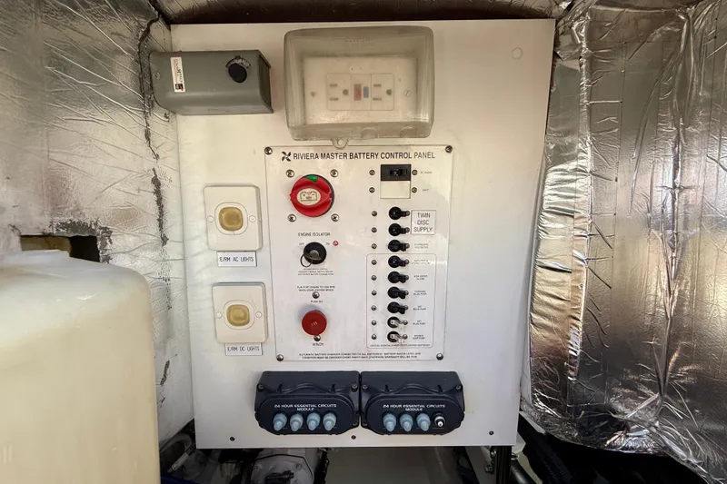 Slide: The Image of Riviera 40 Flybridge 2003 master battery control panel with switches and isolators. - 97