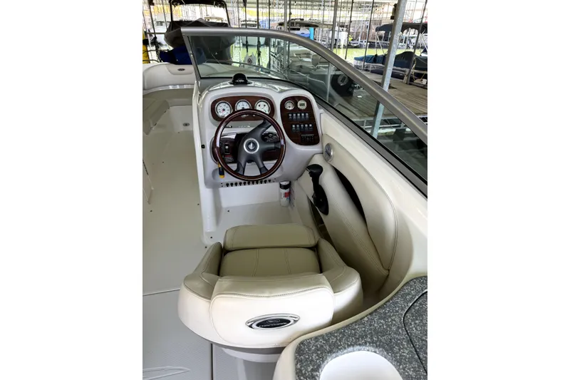 Slide: The Image of 2005 Chaparral 256 SSi boat interior with steering wheel and dashboard controls. - 10