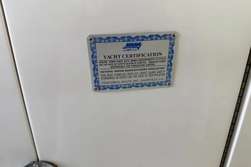 Slide: The Image of Yacht certification plaque on 2005 Chaparral 256 SSi, verifying compliance with safety standards. - 12