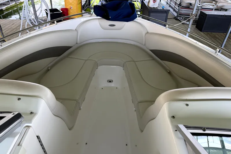 Slide: The Image of 2005 Chaparral 256 SSi boat interior with spacious seating and sleek design. - 9