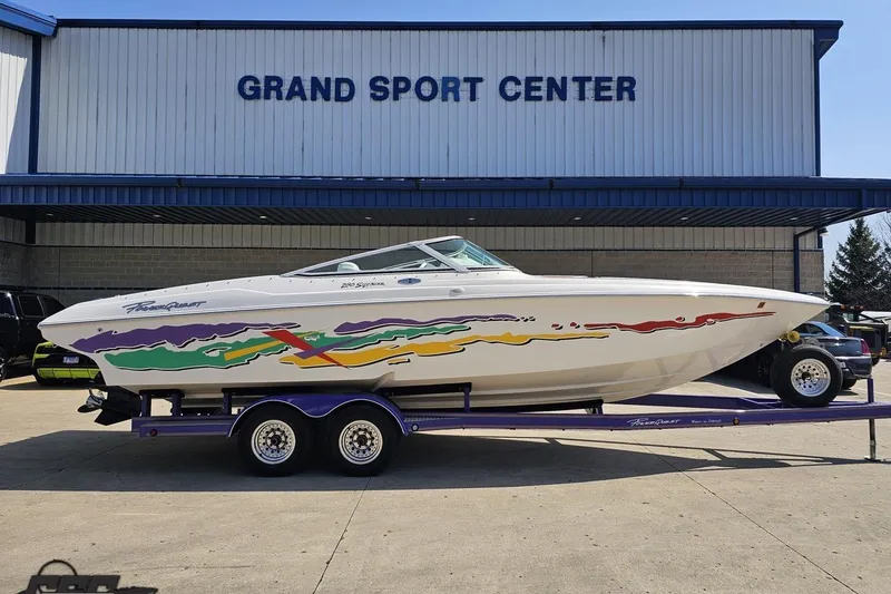 The Image of 2001 Powerquest 280 Silencer boat on trailer at Grand Sport Center. - 1