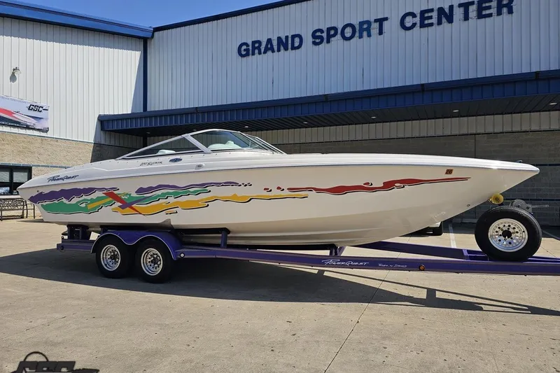 Slide: The Image of 2001 Powerquest 280 Silencer boat on trailer at Grand Sport Center. - 10