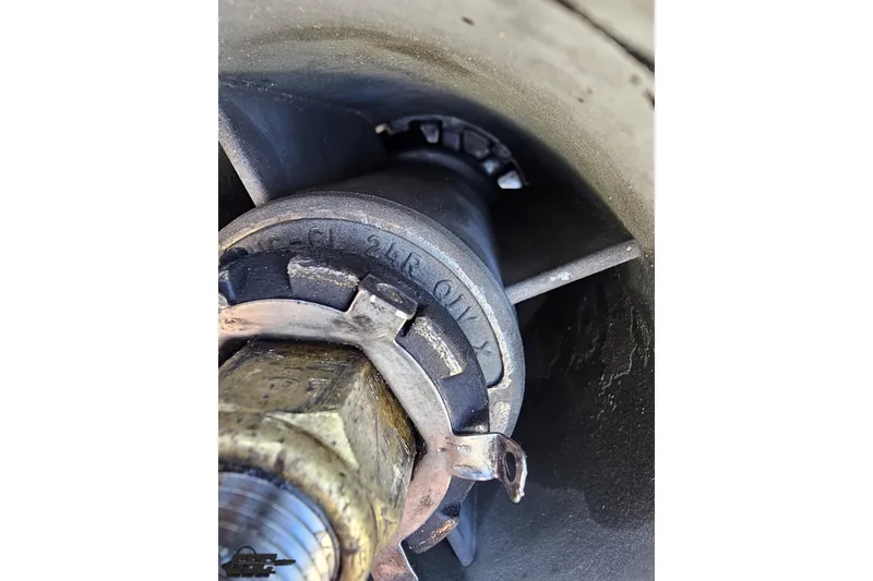 Slide: The Image of Close-up of a 2001 Powerquest 280 Silencer boat propeller hub and nut assembly. - 27