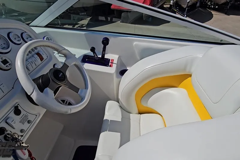Slide: The Image of Interior of a 2001 Powerquest 280 Silencer boat with white and yellow seating. - 52