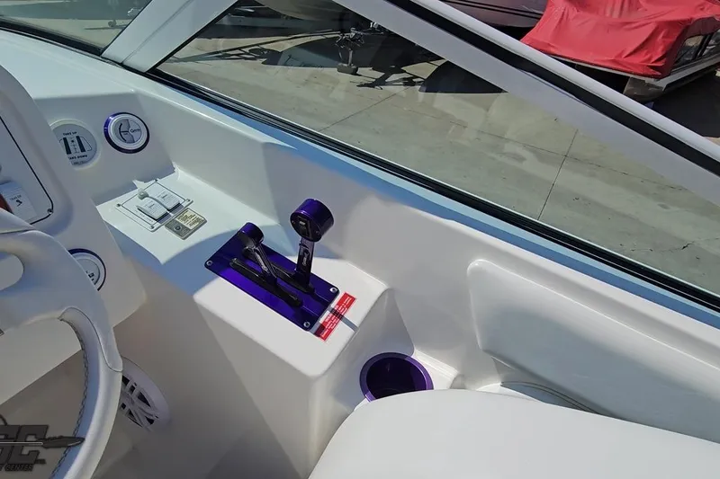 Slide: The Image of Interior view of a 2001 Powerquest 280 Silencer boat cockpit with controls and gauges. - 53