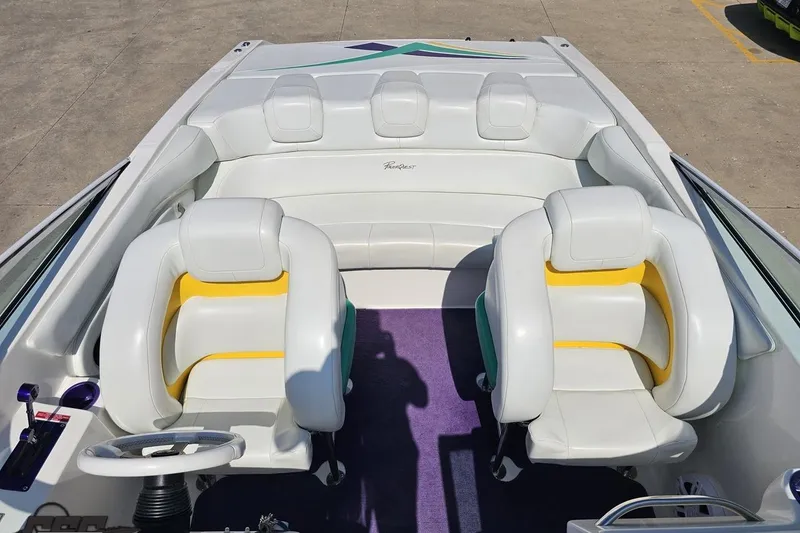 Slide: The Image of Interior of 2001 Powerquest 280 Silencer boat with white and yellow seating. - 61