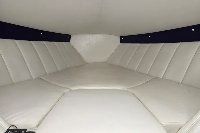 Slide: The Image of Interior cabin of 2001 Powerquest 280 Silencer boat with white upholstery. - 65