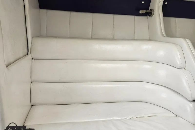 Slide: The Image of 2001 Powerquest 280 Silencer interior with white leather seating and sleek design. - 68