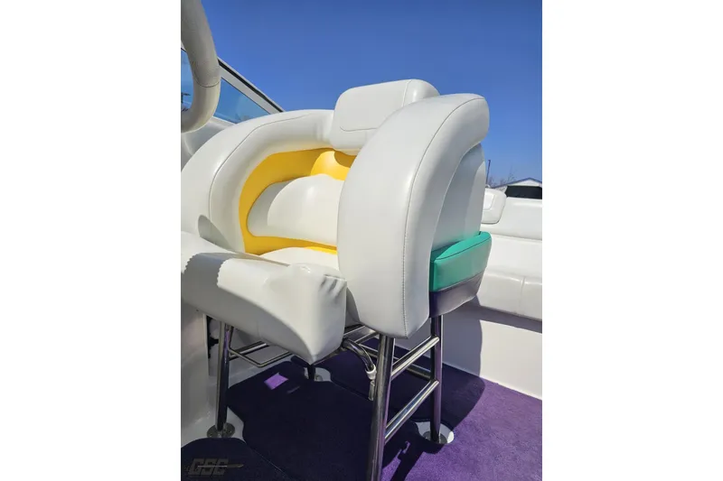 Slide: The Image of 2001 Powerquest 280 Silencer boat seat with white, yellow, and teal accents. - 71