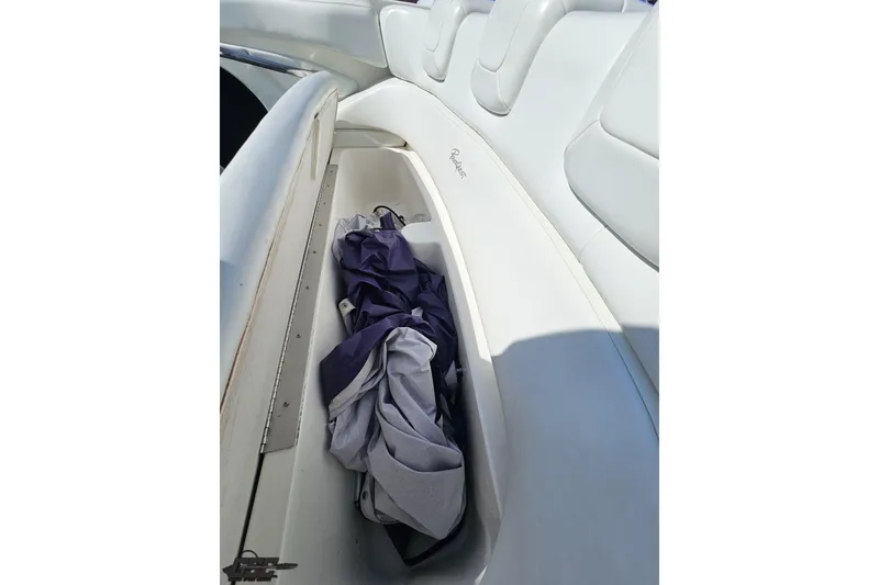 Slide: The Image of Interior view of a 2001 Powerquest 280 Silencer boat with storage compartment. - 73