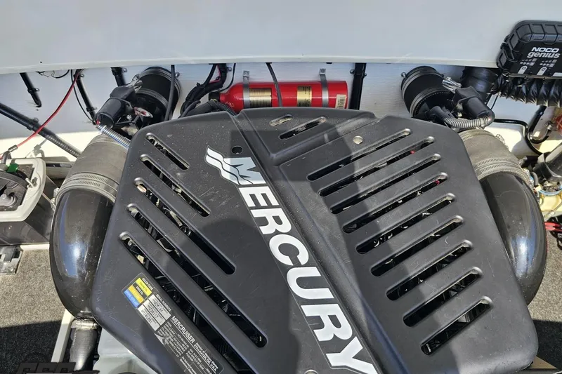 Slide: The Image of Engine compartment of a 2001 Powerquest 280 Silencer with Mercury engine components. - 78