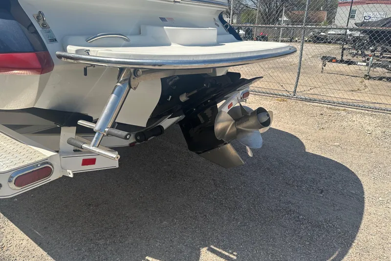 Slide: The Image of Rear view of a 2006 Cobalt 220S boat with propeller and swim platform. - 17