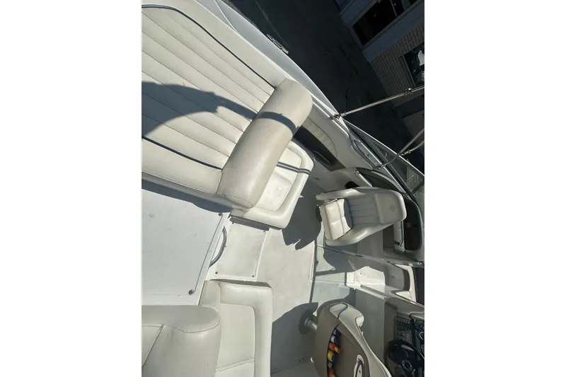 Slide: The Image of Interior of a 2006 Cobalt 220S boat with white leather seating. - 22
