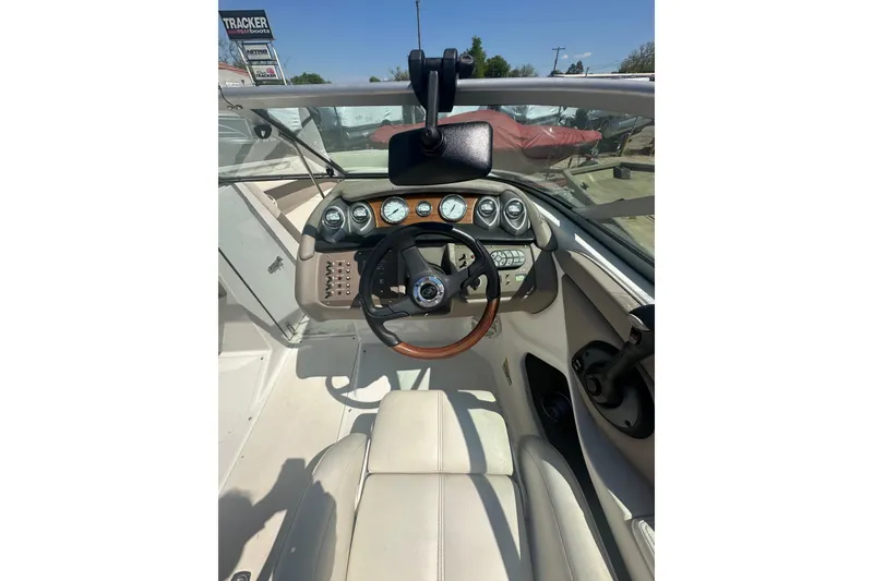 Slide: The Image of 2006 Cobalt 220S boat dashboard with steering wheel and instrument panel. - 25